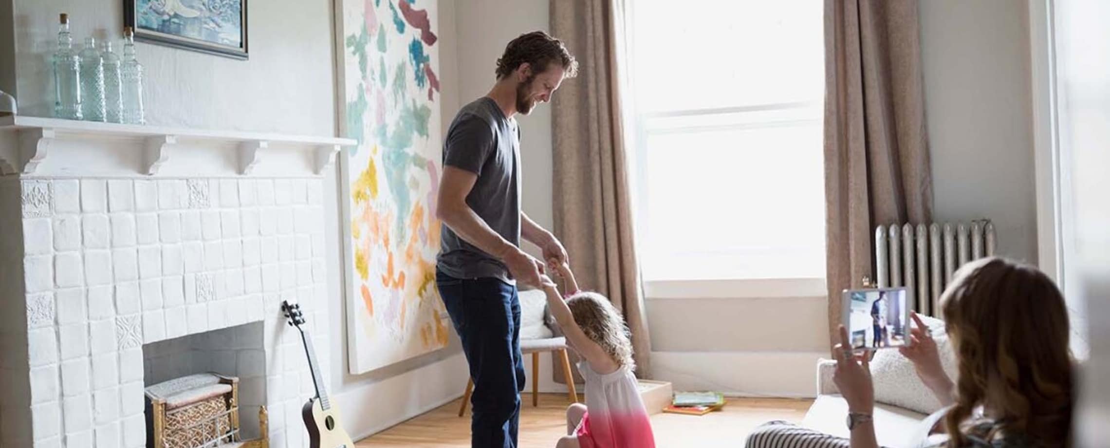 Parents playing with daughter