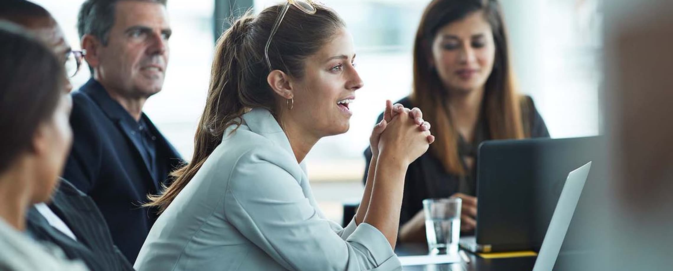 motivated worker speaking at meeting