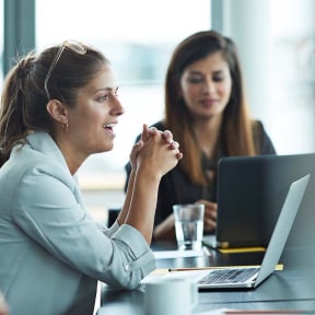 motivated worker speaking at meeting