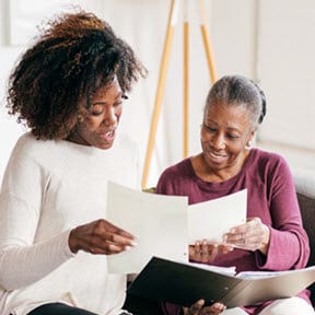 Young adult advising parent.