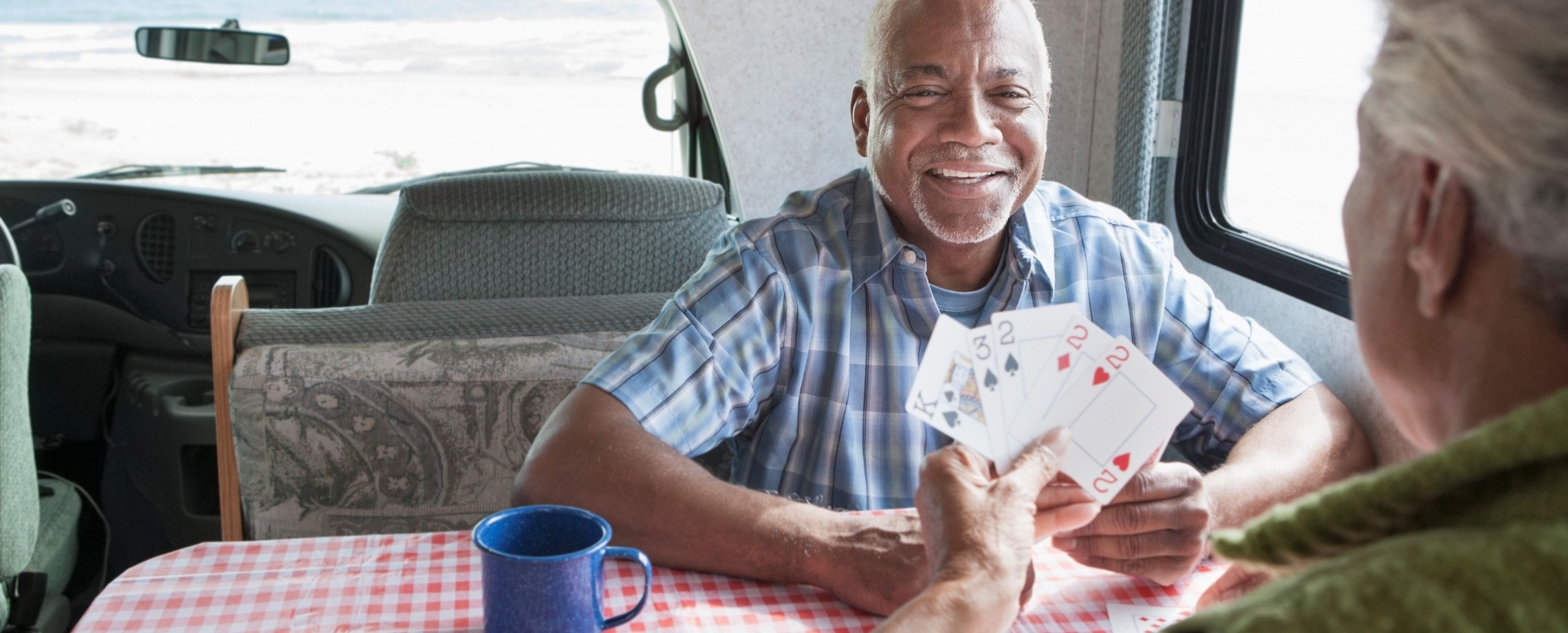 older couple playing cards