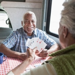 older couple playing cards