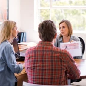 couple discussing with financial professional