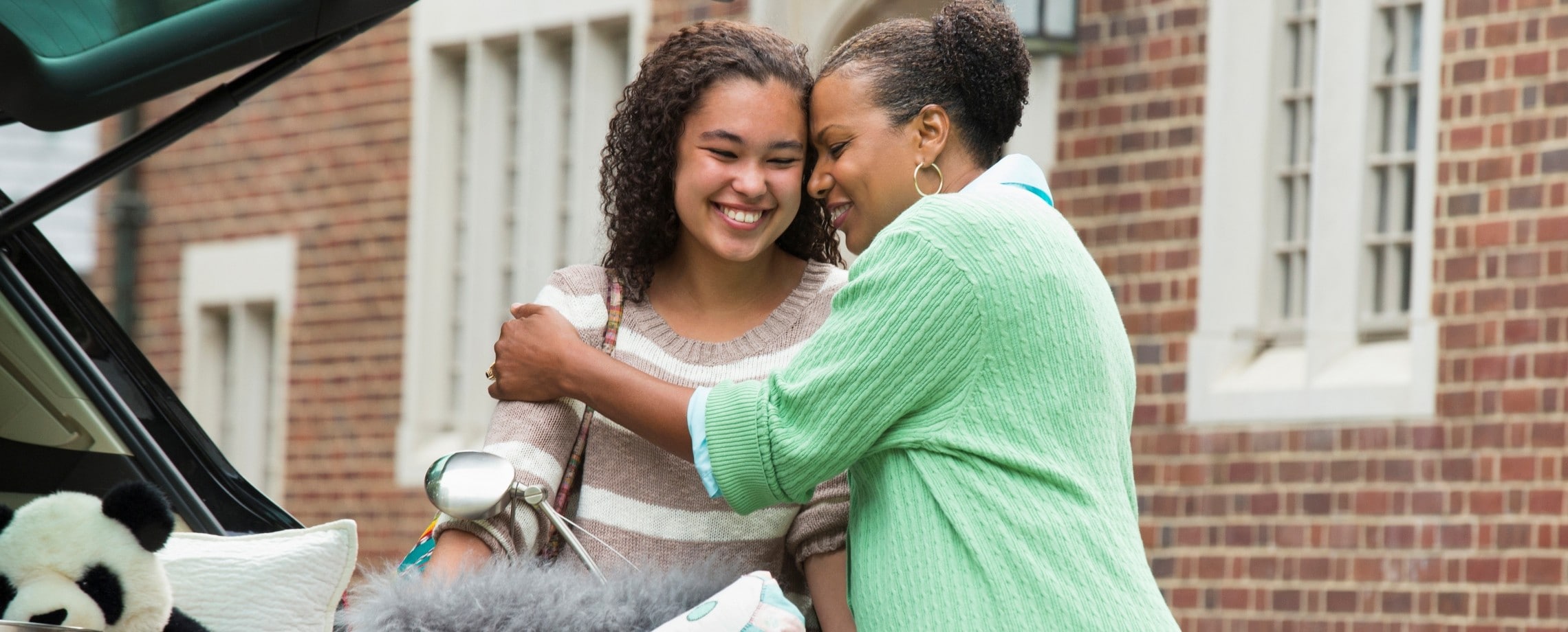 Mom moving daughter into dorm.
