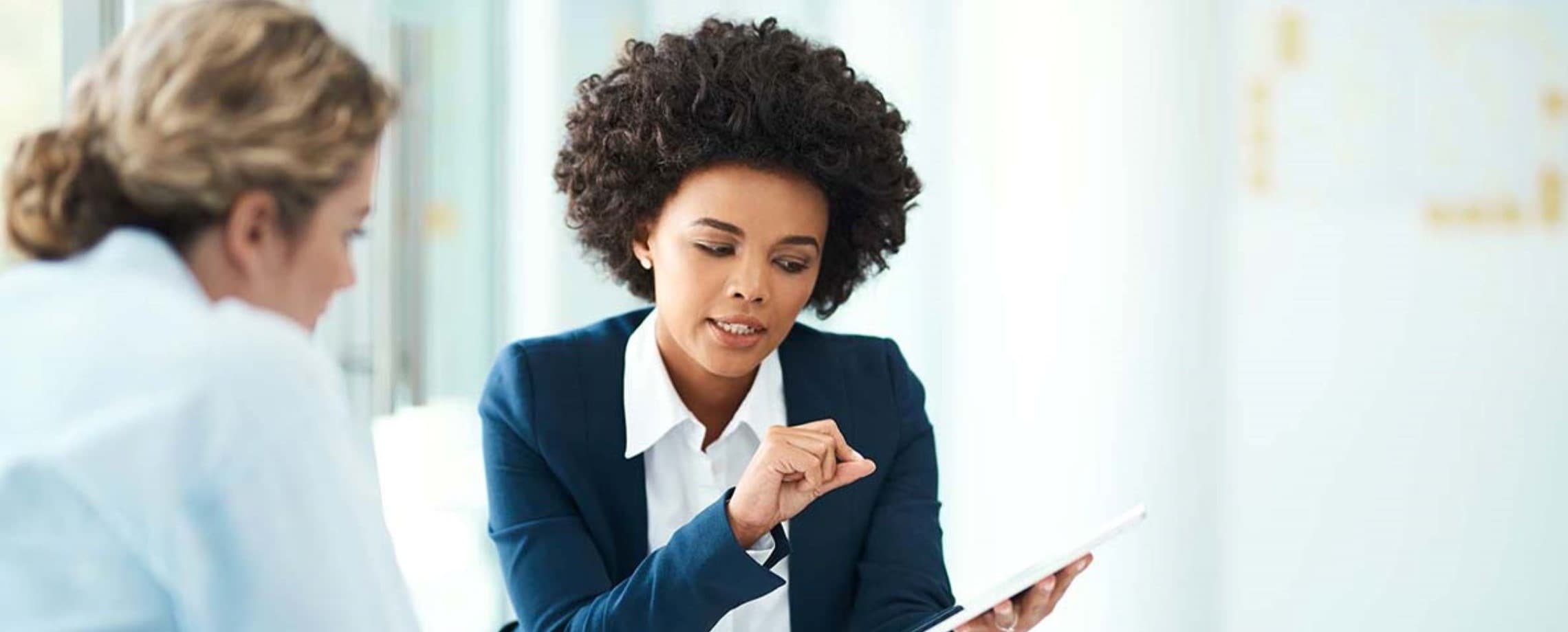 Financial professional with client discussing interest rates