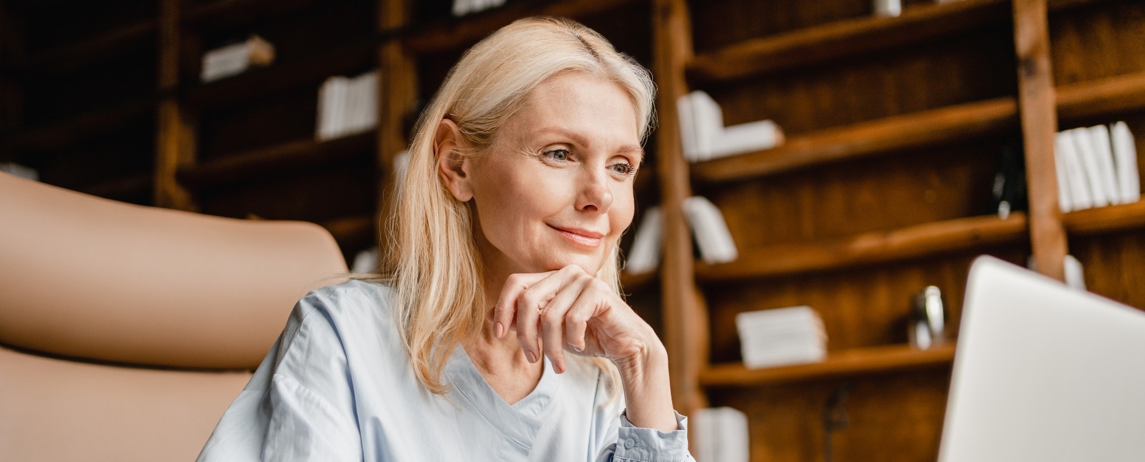 Woman in front of laptop.