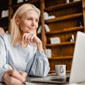 Woman in front of laptop.