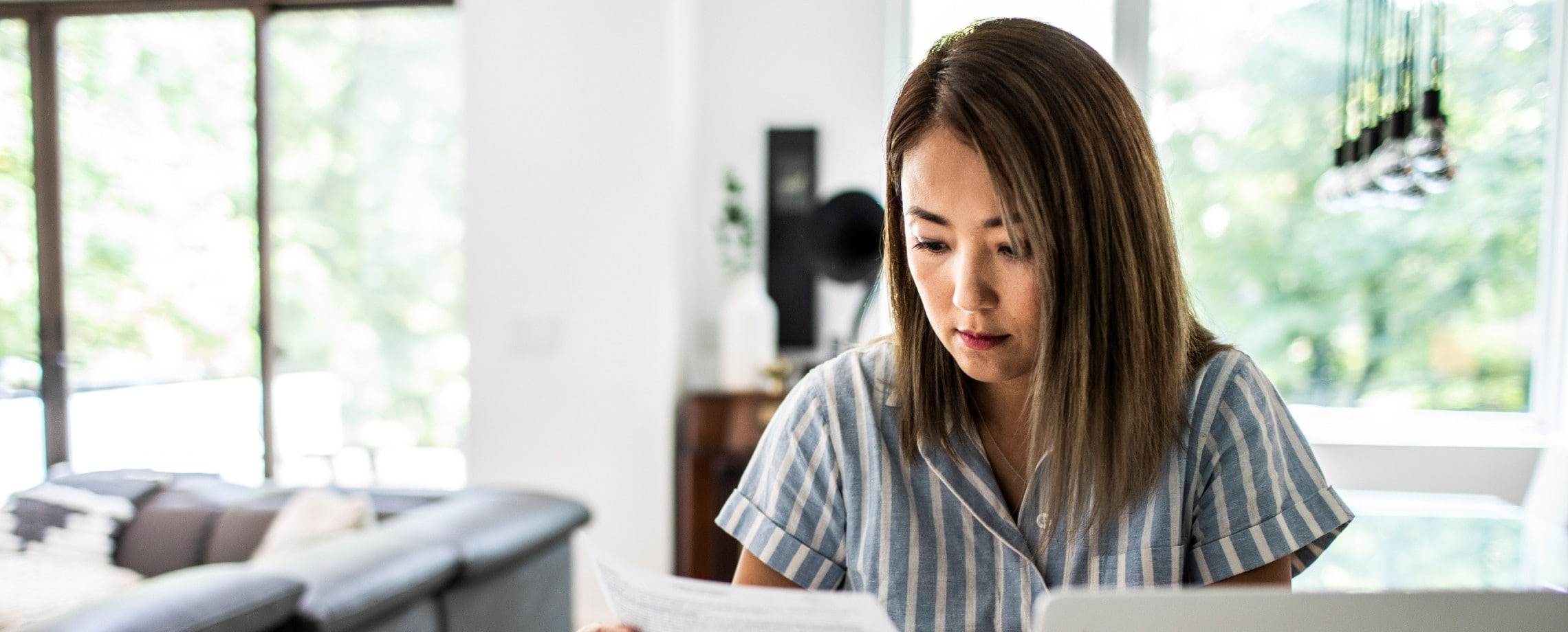 Woman reviewing her bank statements.