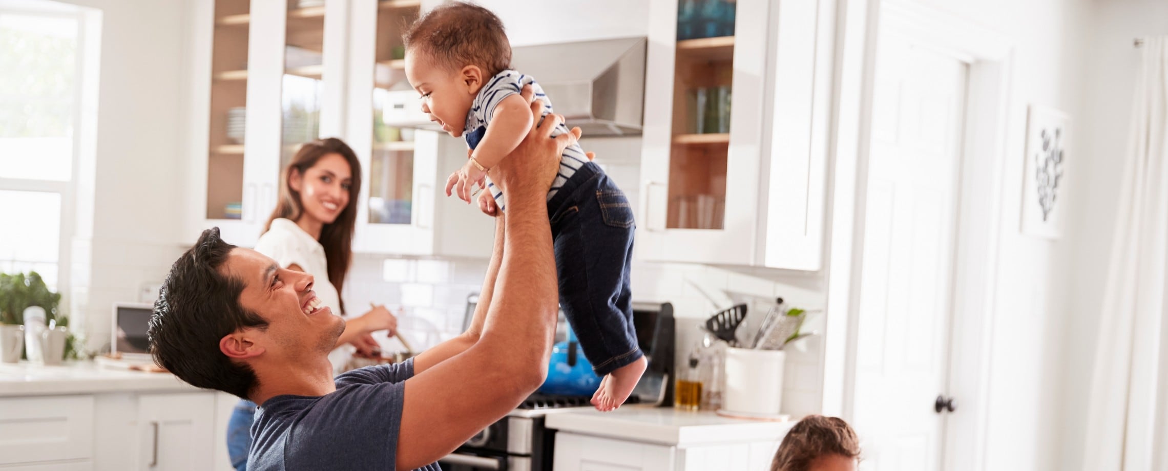 Father playing with baby.