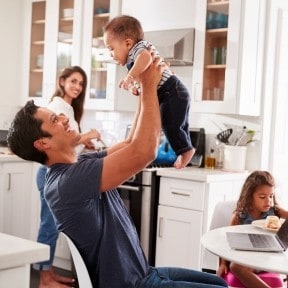 Father playing with baby. 