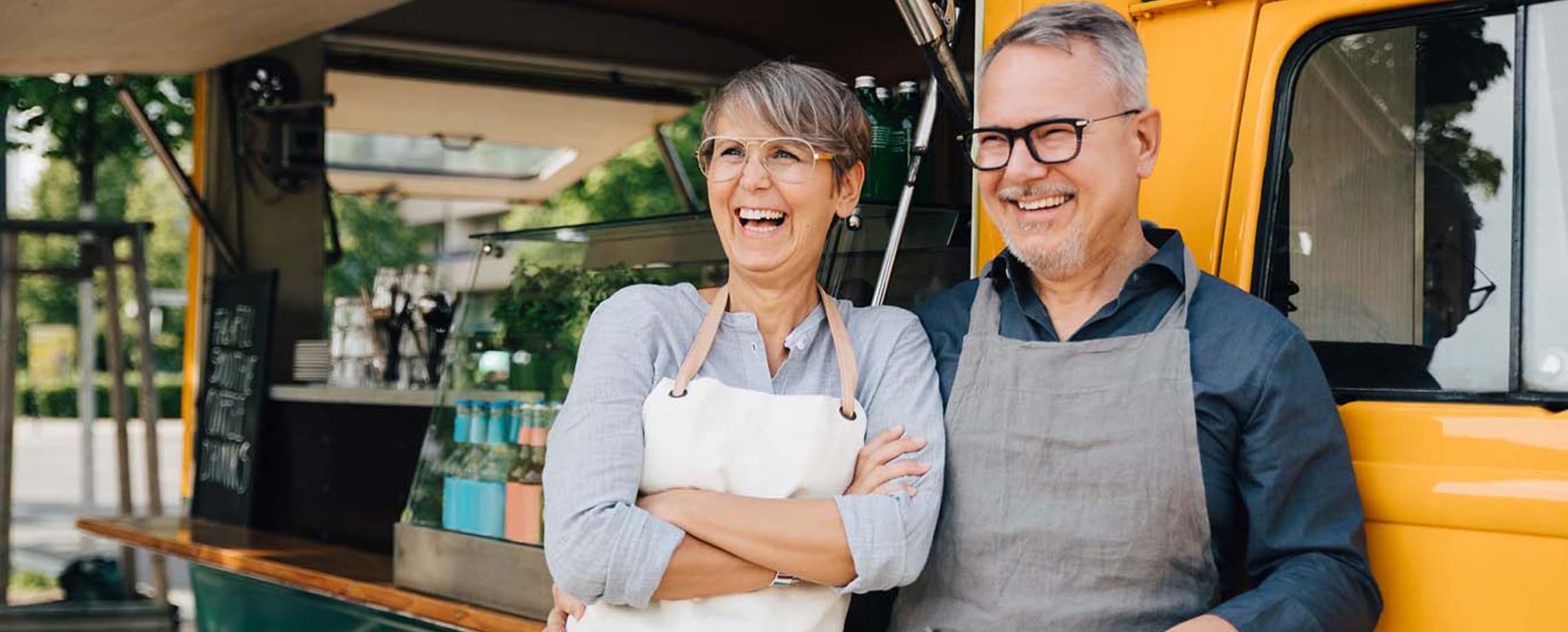 couple laughing by food truck