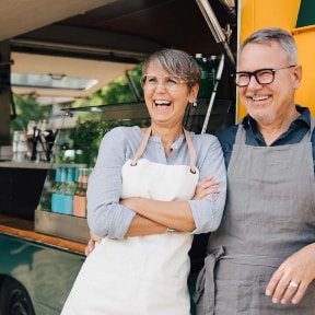 couple laughing by food truck