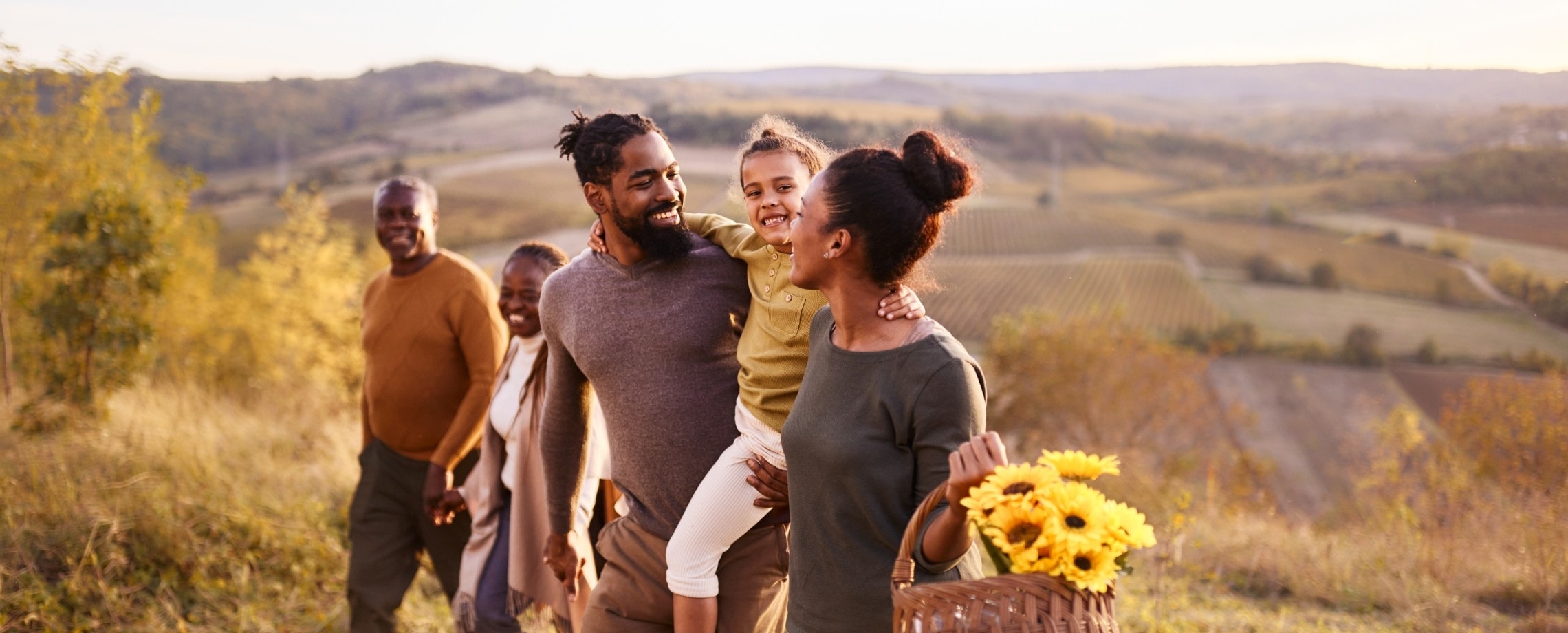Family walking in a field.
