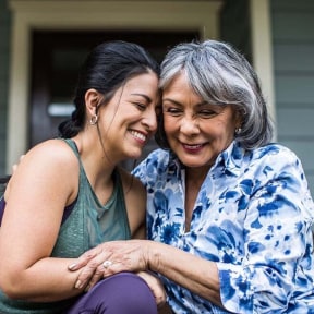 Mother and daughter hugging