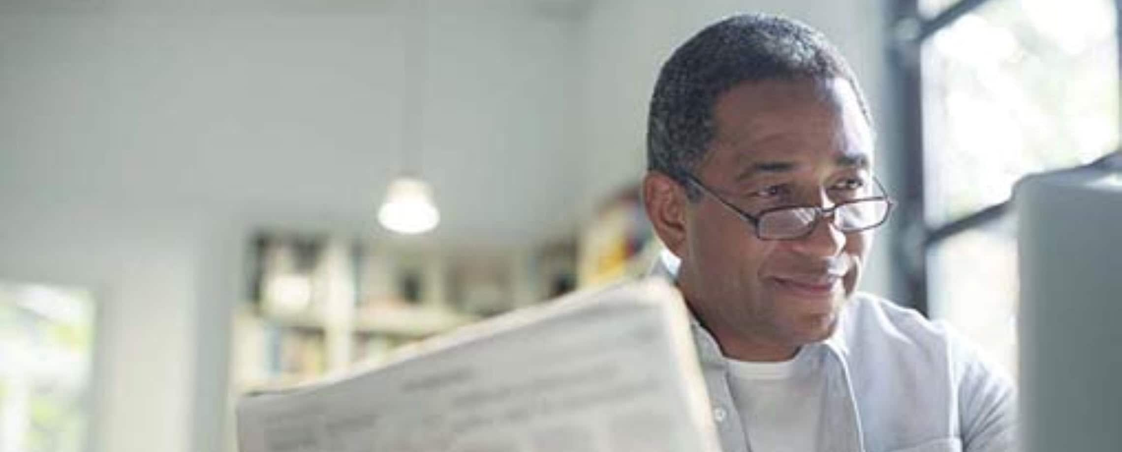 Man reading newspaper