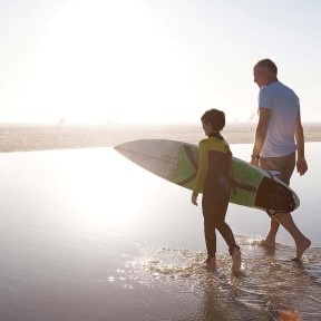 surfing kid and grand dad