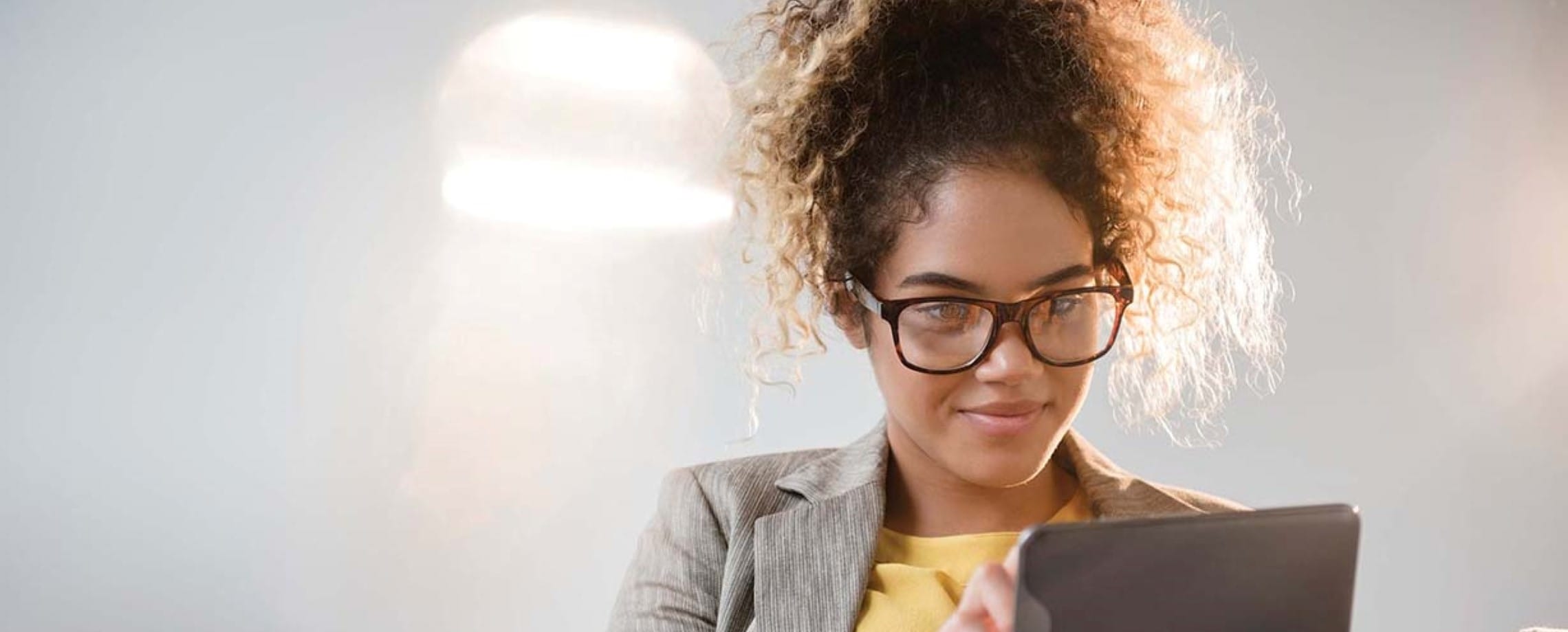 woman contemplating via tablet