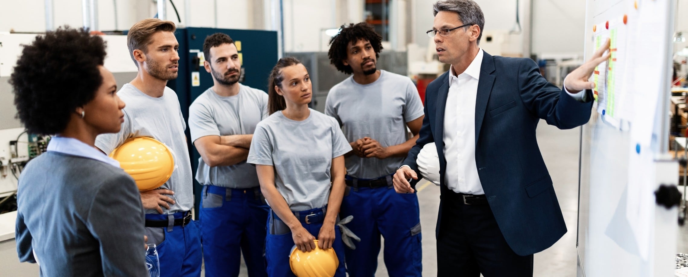 business owner talking to employees