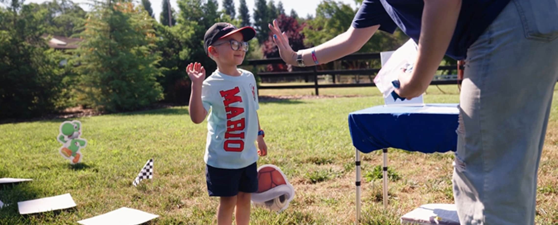 kid high fiving