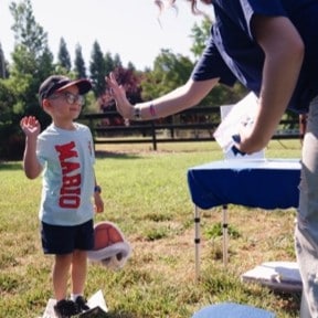 kid high fiving