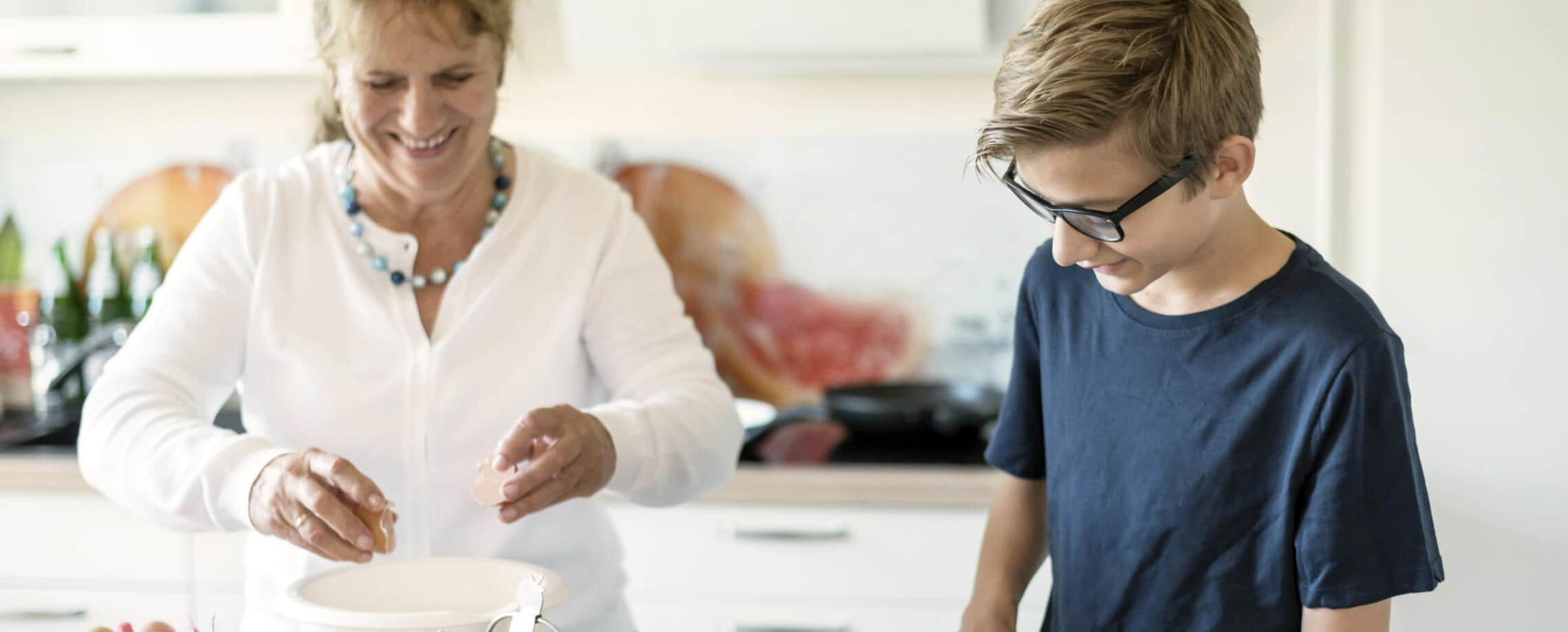 two people cooking