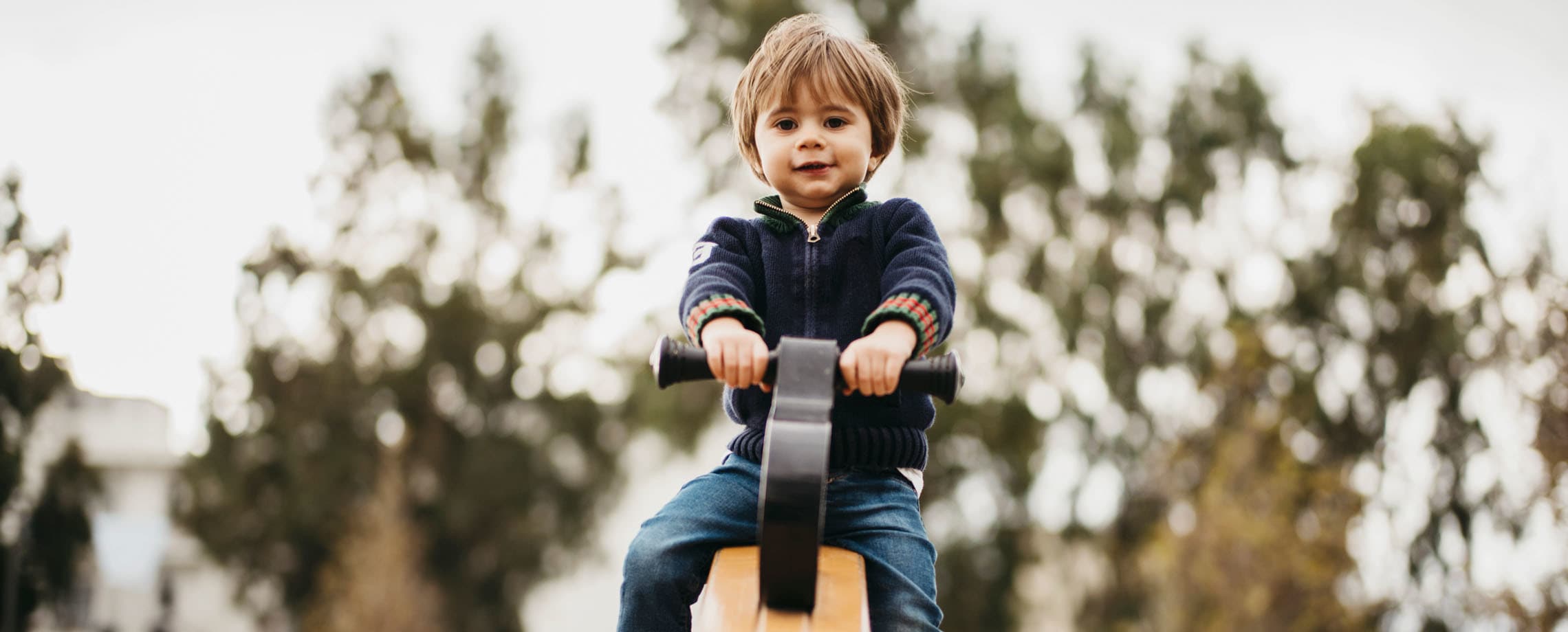 Small boy on a riding rocking horse