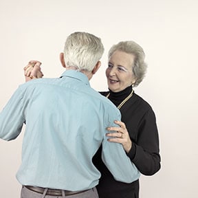 Elderly Caucasian couple dancing