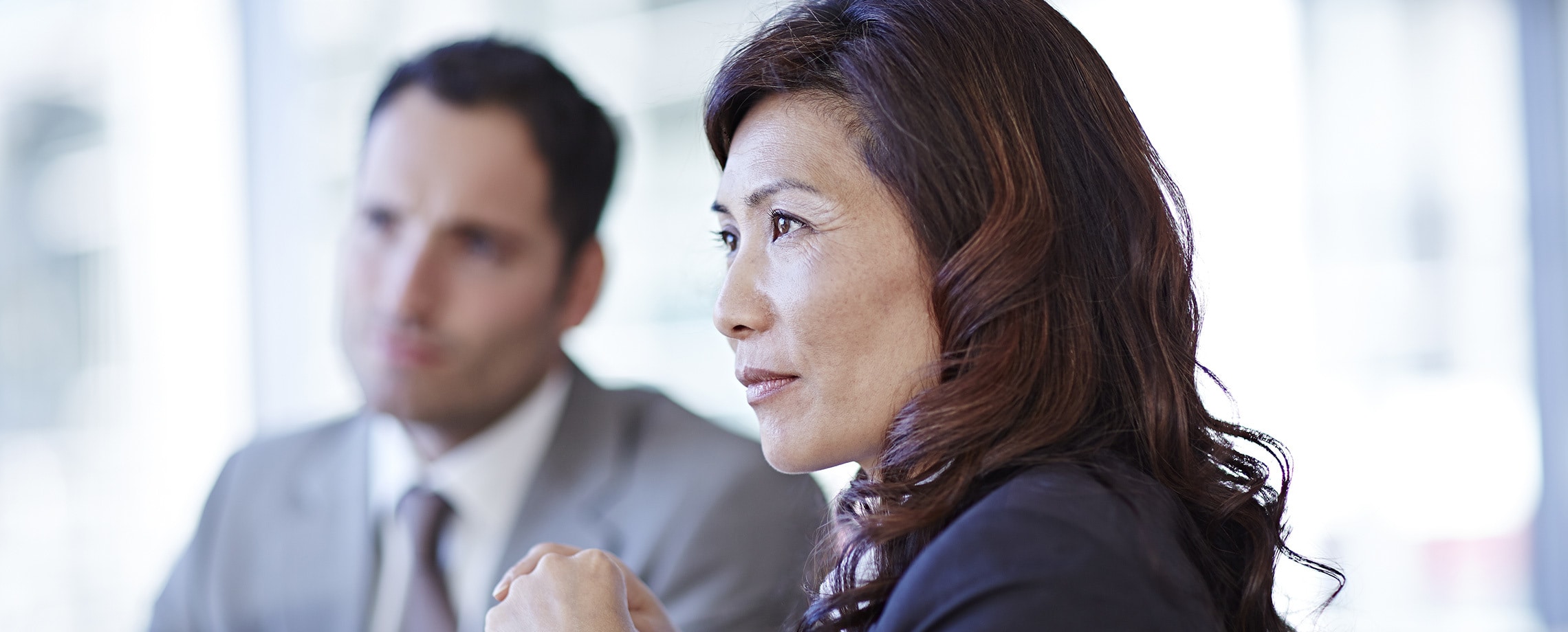 Asian woman listening intently