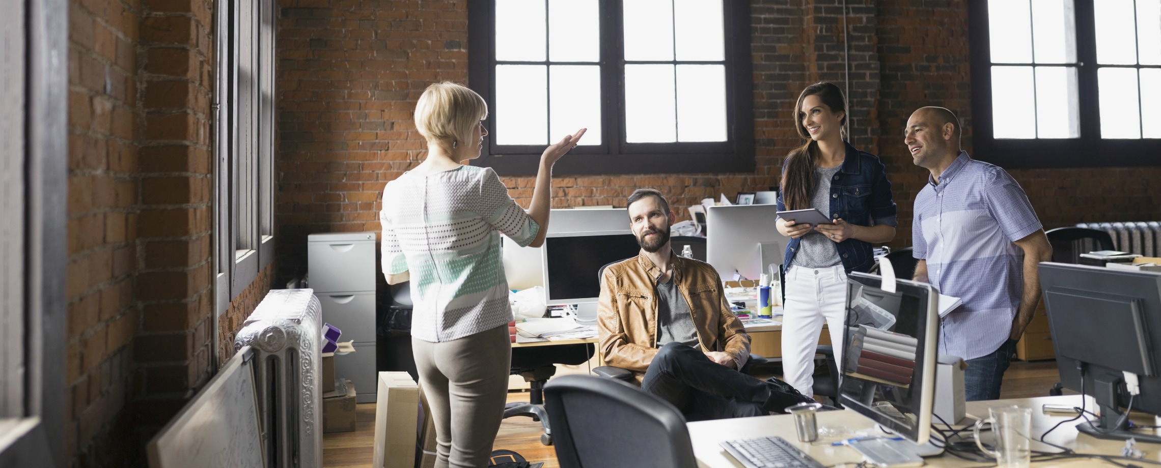 Businesspeople meeting in a converted industrial building office