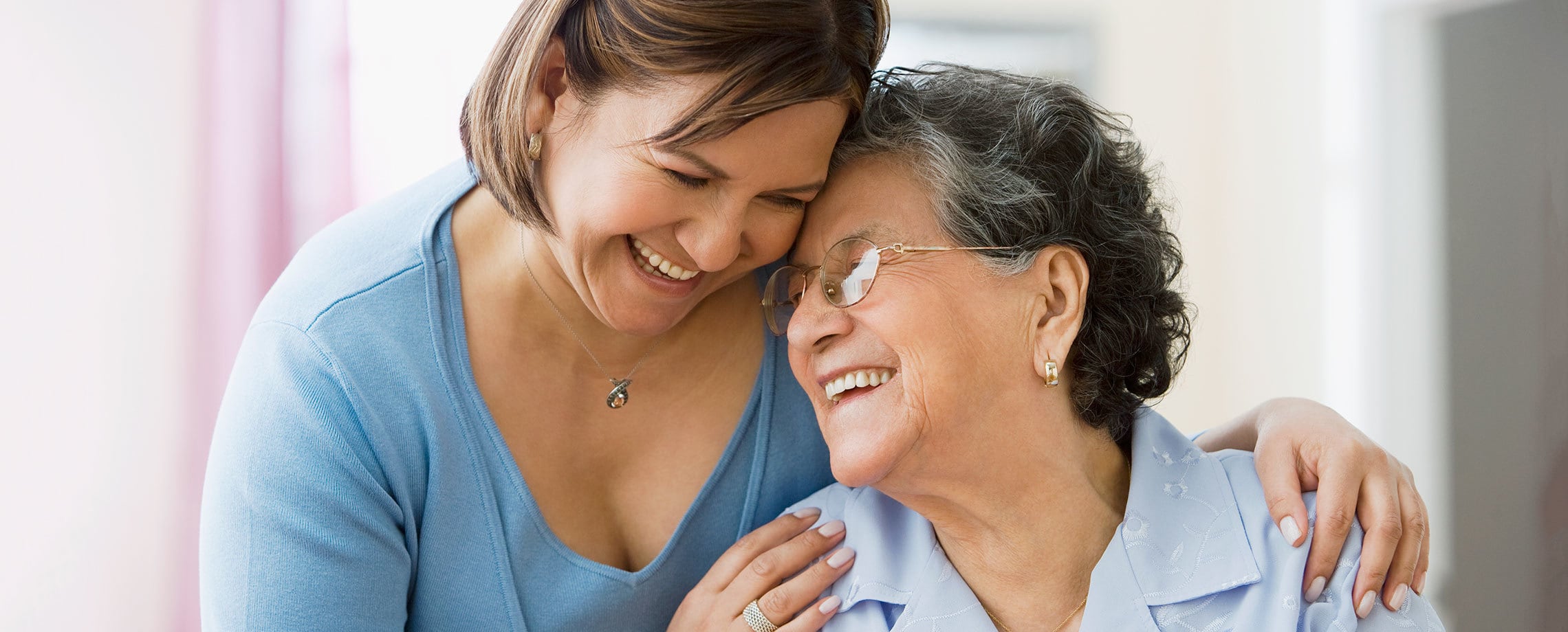 Younger woman comforting an older woman