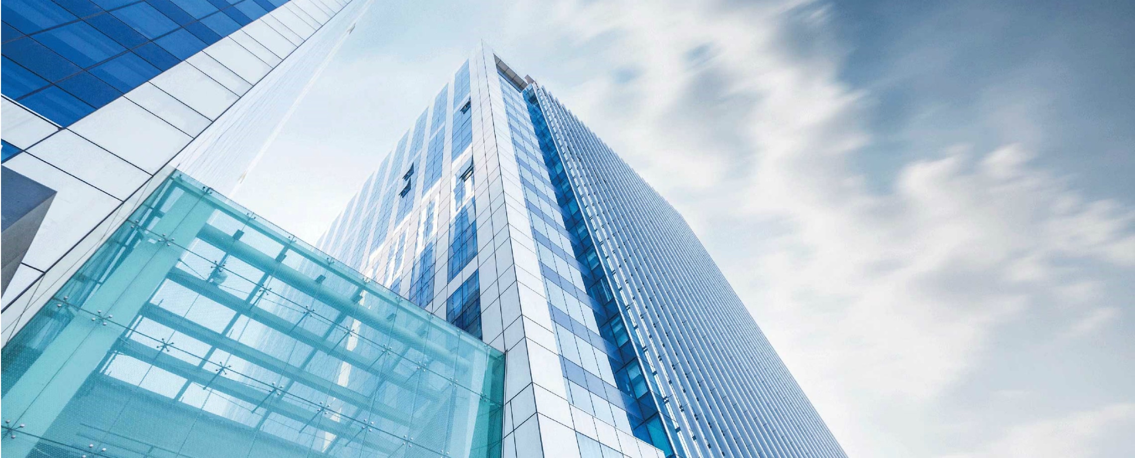 Looking up at glass skyscrapers