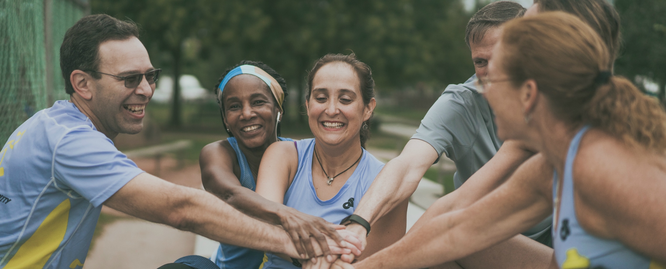 People of various races rallying team for an athletic event