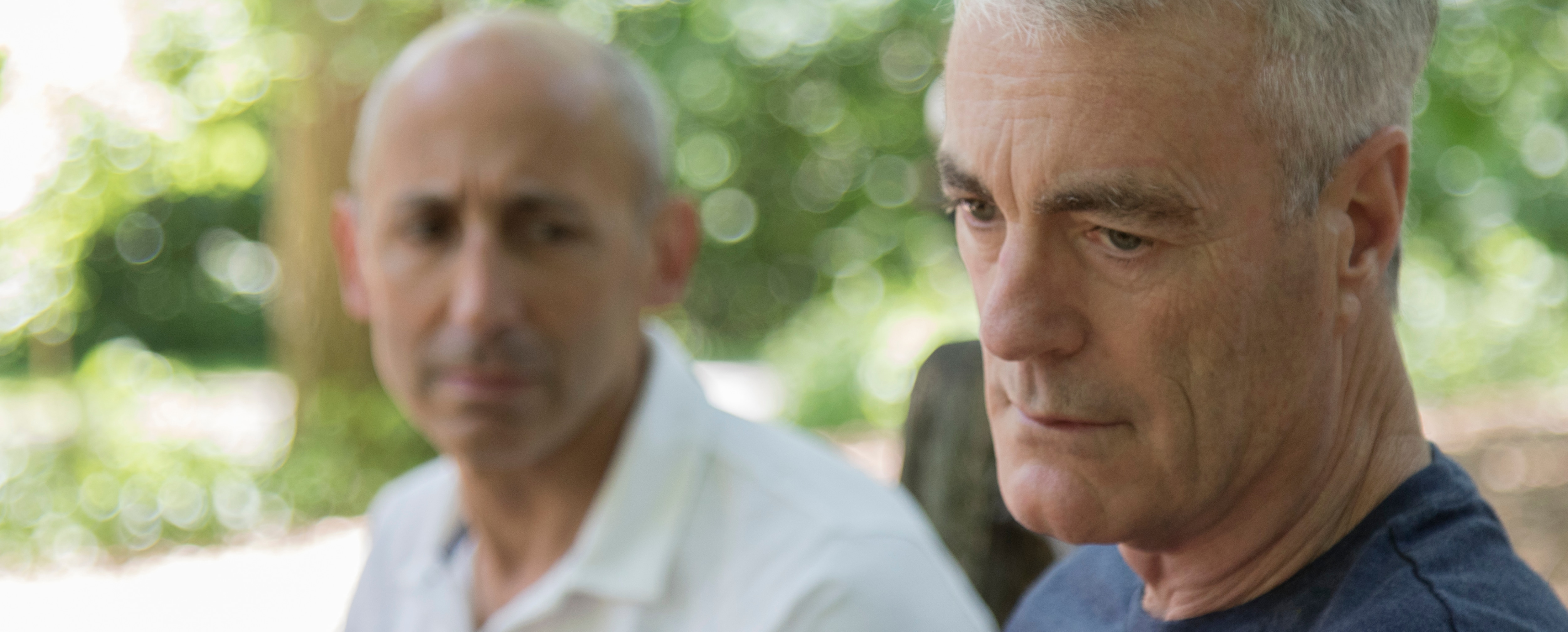 Close up of two pensive men