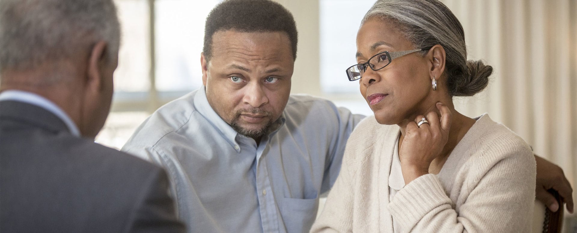 African-American couple listening to financial advisor