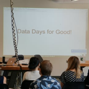 Presentation room with ?Data Days for Good!? projected on screen