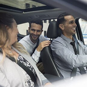 Three businesspeople in a car together